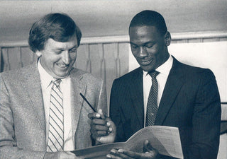 Jordan signing his first contract with Nike